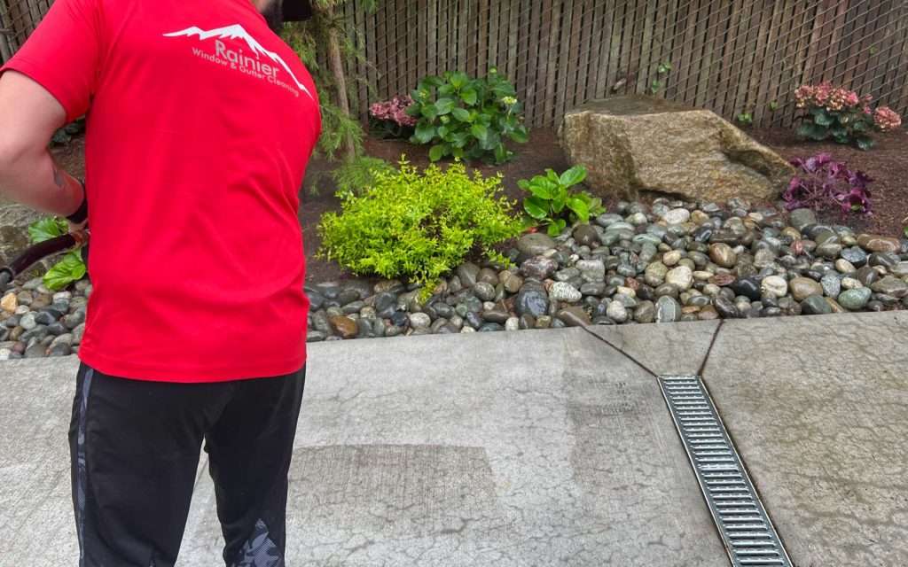 clean spot next to dirty spot on driveway professional pressure cleaning